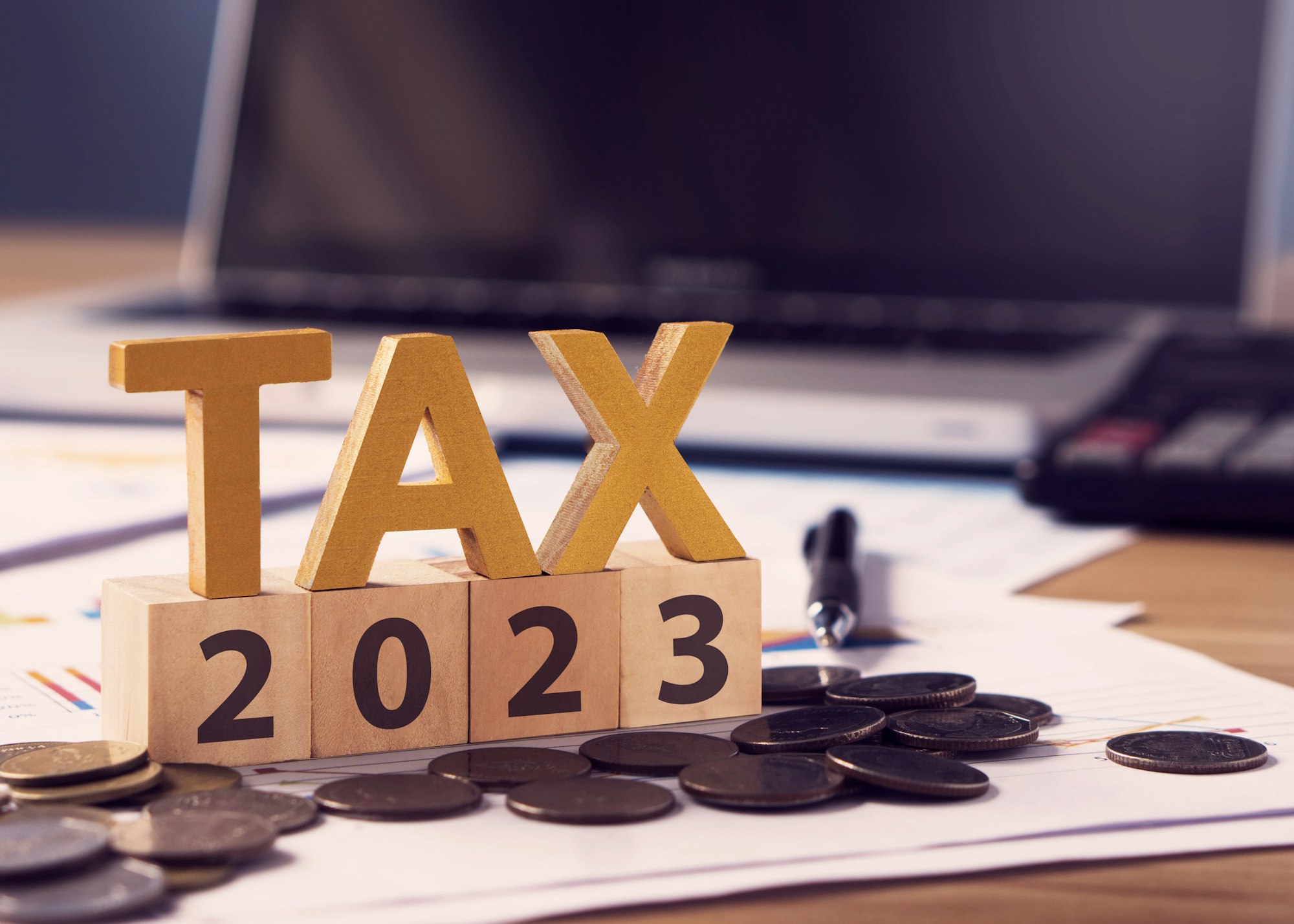 Tax letter and 2023 number on wooden block.Pay tax in 2023 years.The new year 2023 tax concept.